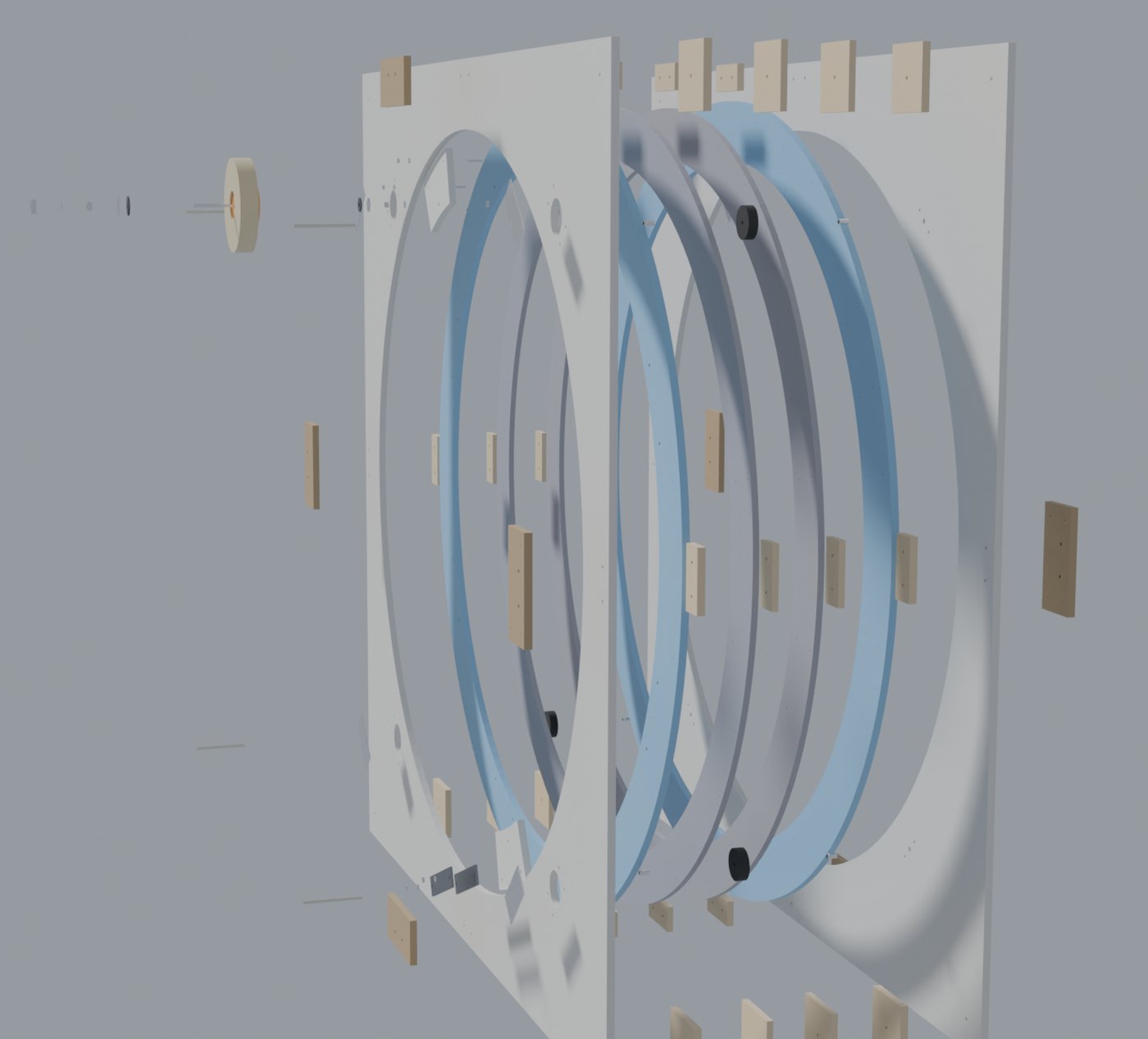 The same machine drawn pulled apart along its axis, showing two flat panels, four separate ring layers between them, rows of small spacer blocks, and the tape roll flying off to one side