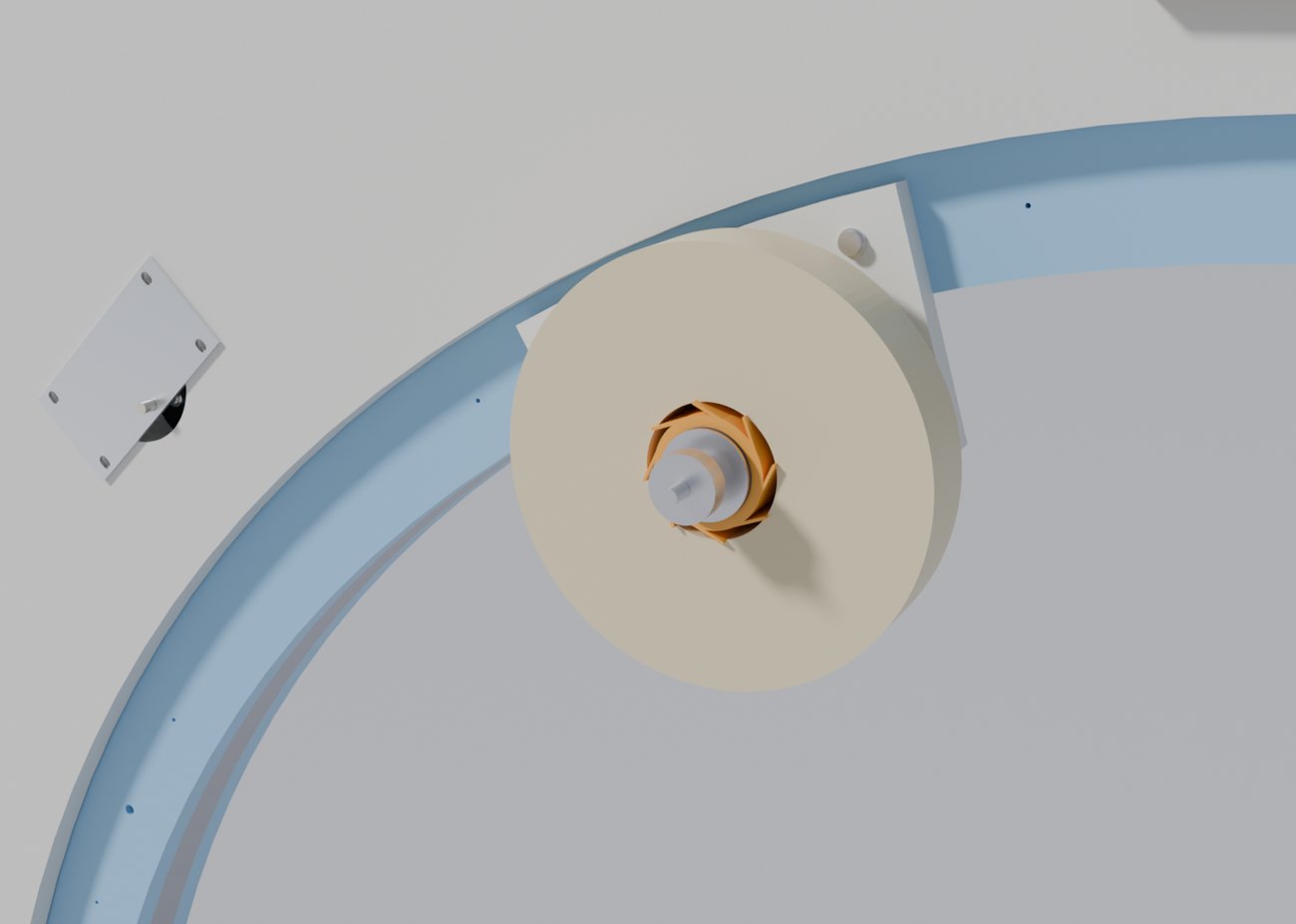 A close view of a roll of tape on a printed hub with splayed fins, mounted on a bracket bolted to the inner face of the ring